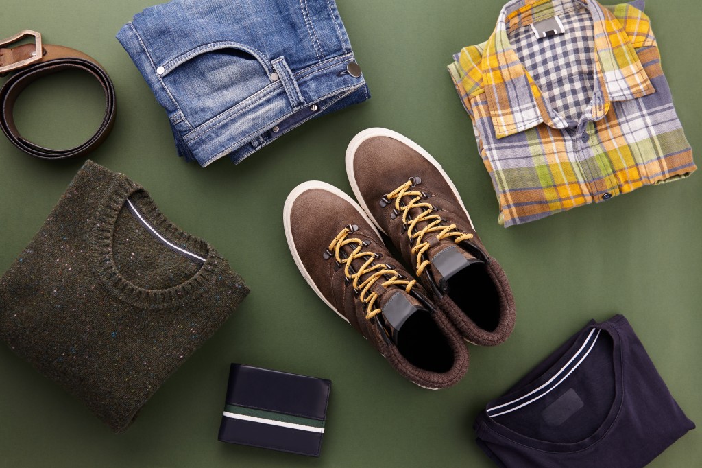 Mens fall casual clothes flat lay on green