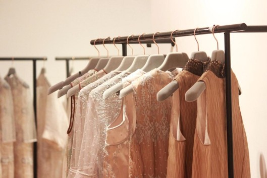 Rack of colorful party dresses in a boutique